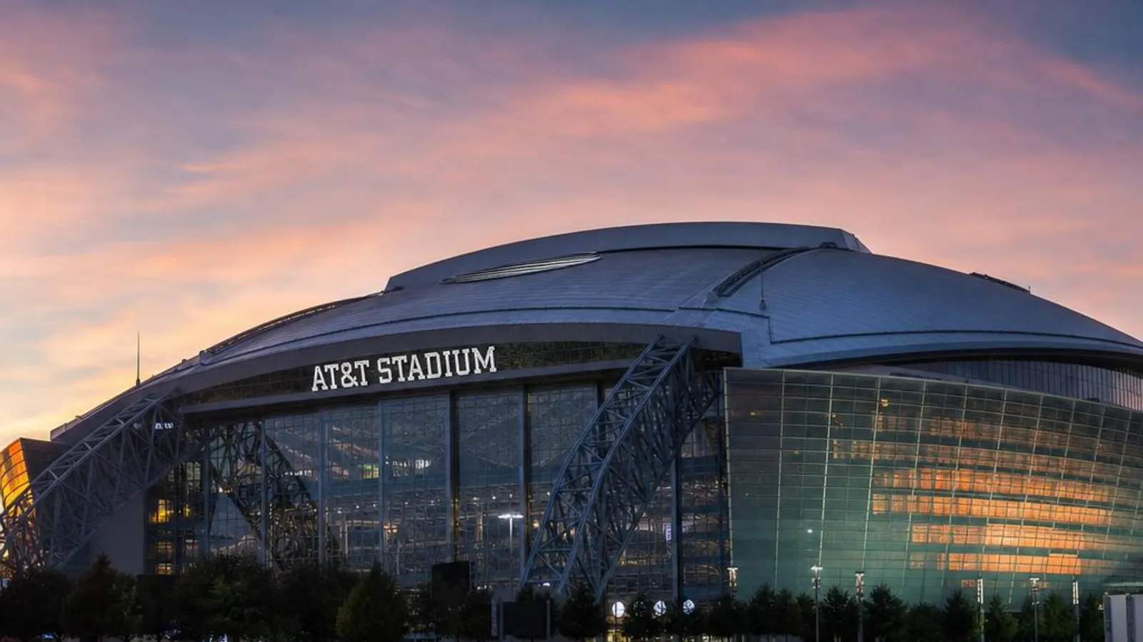 Modern sports stadium in Arlington, Texas at dusk